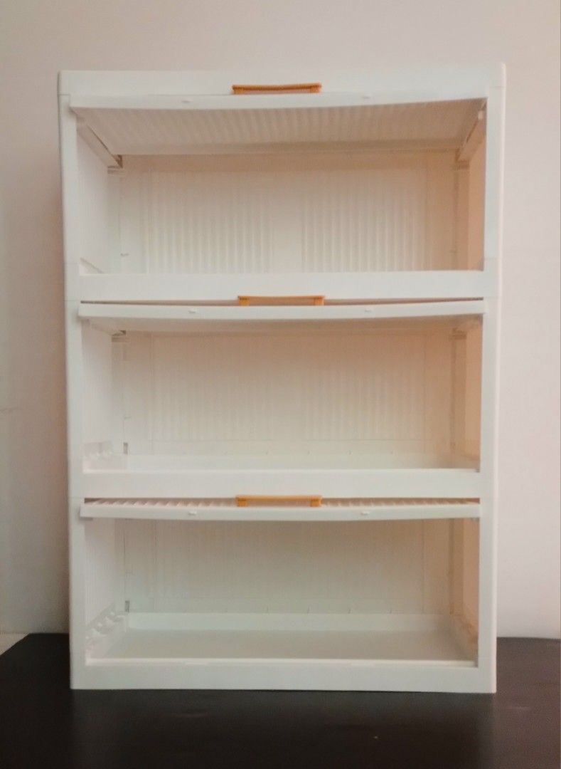 White 3-Tier Storage Cabinet (Category: Shelves, Cabinets & Racks) located in Pasig City. Submitted by kuhkuh (Listing ID 1460955358, Image 2). Description: White storage cabinet (3-tier) Short-time used (used as display rack only) 💕Bought in Shopé Php 812. 🎈Now sells @ 700. - Features a ribbed design on the drawer fronts - Equipped with stylish wooden-like handles - Ideal for organizing clothes, toys, or general household items - Smooth and ea