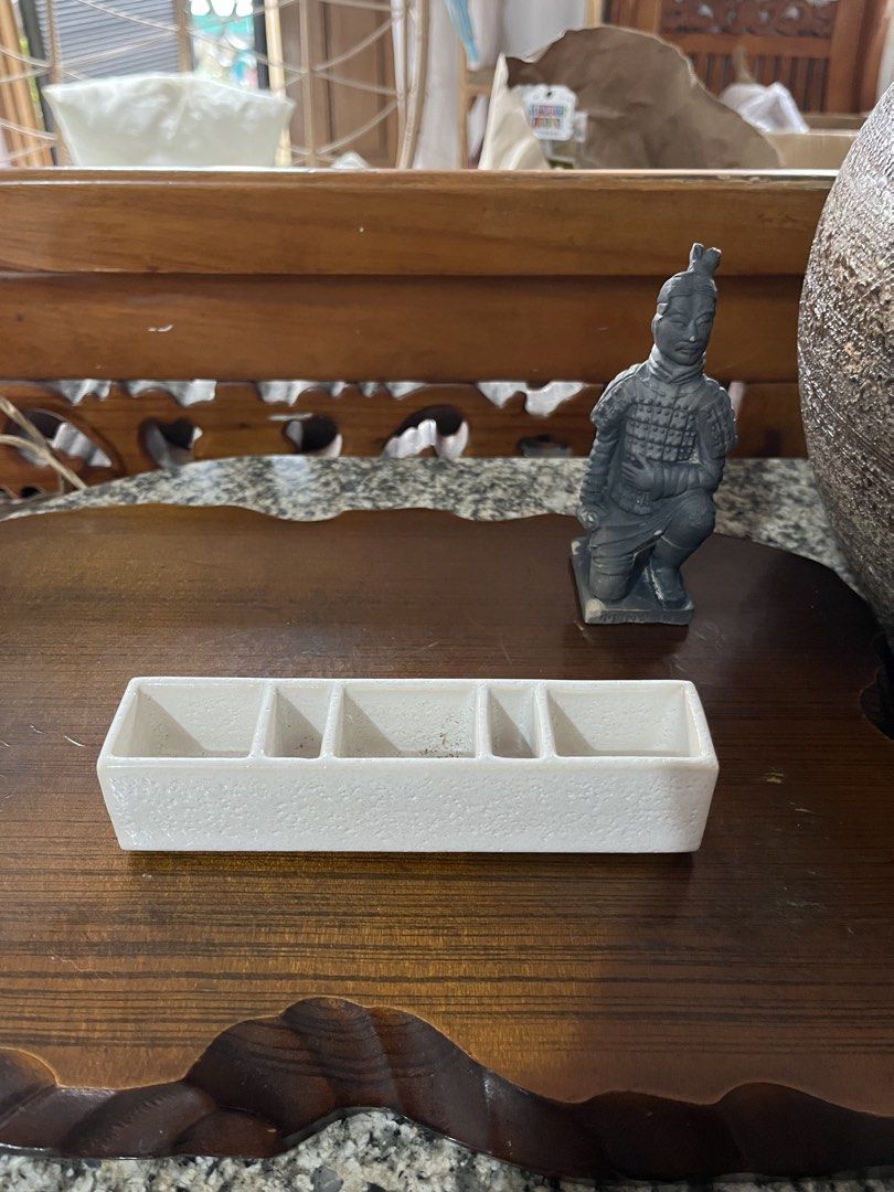 White Ceramic 5-Compartment Trinket Dish Organizer (Category: Other Home Decor) located in Taguig. Submitted by minmin_parker (Listing ID 1461003506, Image 3). Description: - White ceramic dish with 5 compartments - Perfect for organizing small items like rings, earrings, or keys - Features a textured finish - Measures approximately 6 inches long - Adds a stylish touch to your dresser or entryway table.