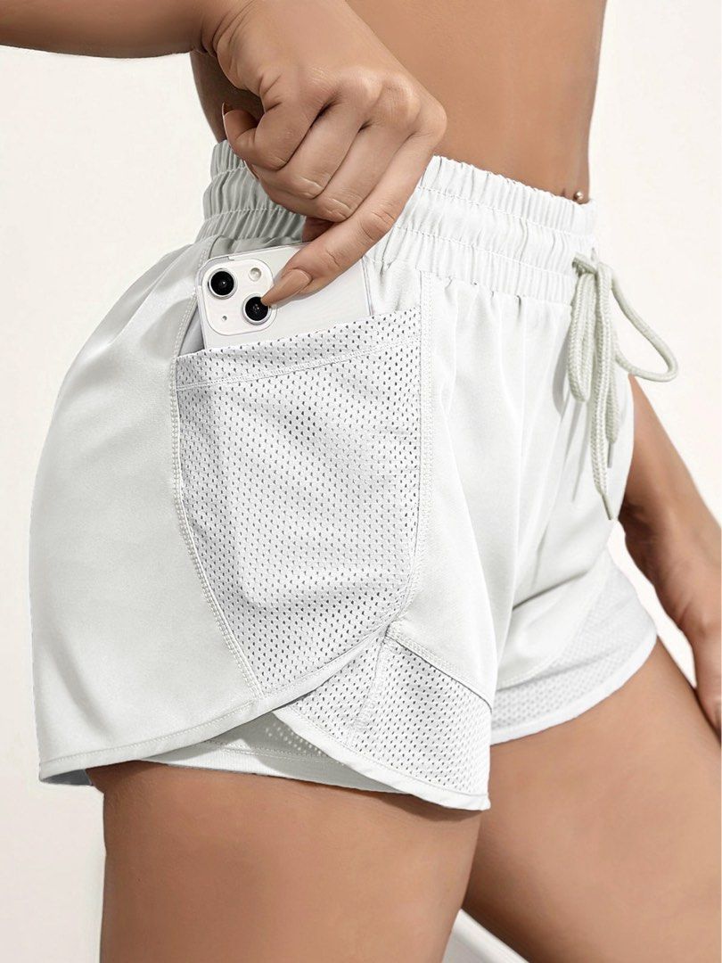 White Double Layer Running Shorts with Pockets (Category: Shorts) located in Bacoor. Submitted by yournewfavorite (Listing ID 1461031276, Image 2). Description: w: 13.5 l: 13 ‼️ black stains in front. havent rlly tried to remove it but you can worn once selling low! similar item like in RUNNR are sold at 2.9k - Lightweight and breathable for ultimate comfort. - Double-layer design: Flowy outer layer with a supportive compression inner layer. - De