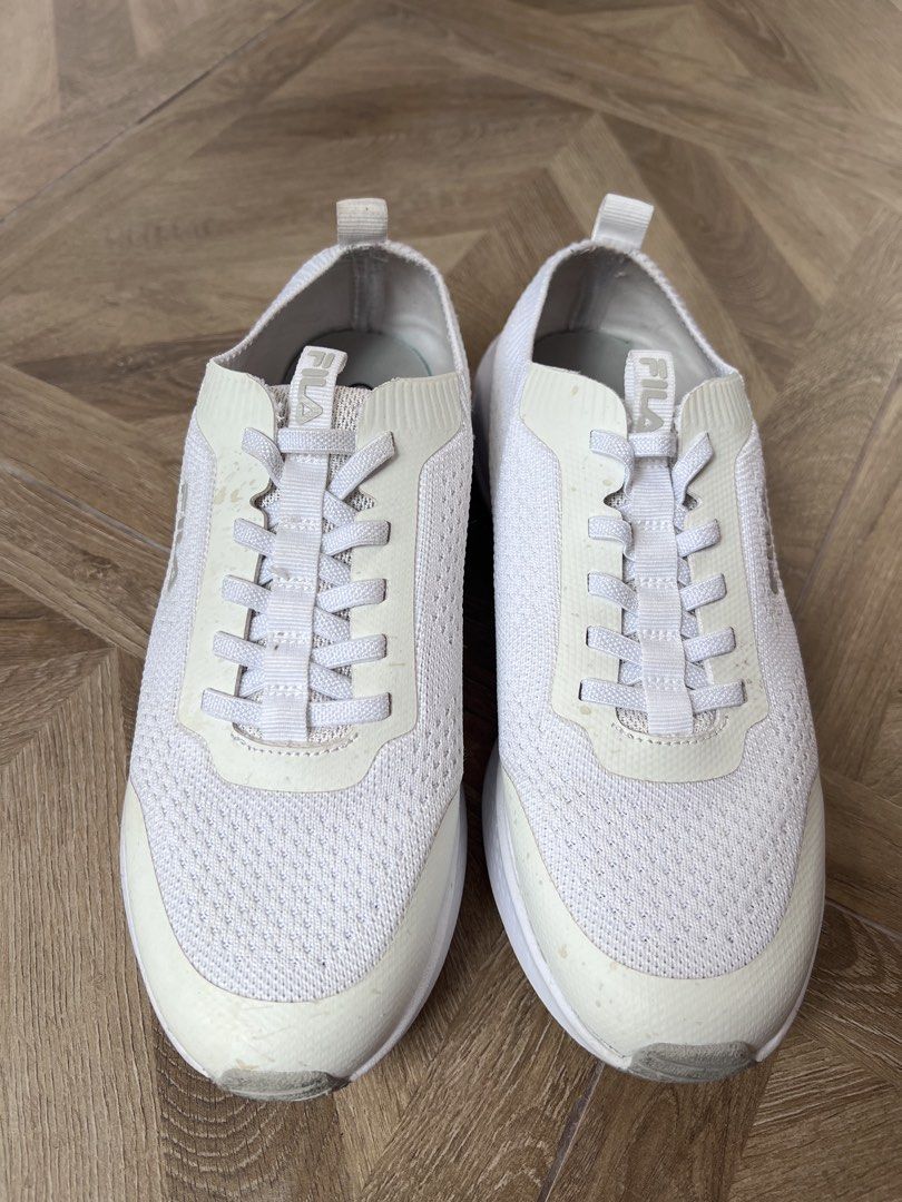 White Fila Knit Sneakers (Category: Sneakers) located in Quezon City. Submitted by peg905 (Listing ID 1460994735, Image 3). Description: - White Fila knit sneakers - Lace-up closure - Comfortable and breathable material - Ideal for casual outings or light exercise.