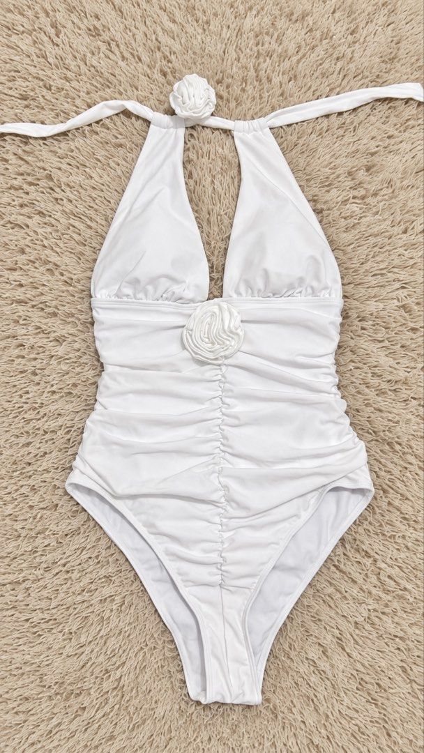 White Halterneck Ruched Swimsuit (Category: Bikinis & Swimsuits) located in Quezon City. Submitted by dearpretty.ph (Listing ID 1461047000, Image 1). Description: Small-Medium size M on tag Camera used: iPhone 15 Pro Max Colors may slightly vary due to lighting.