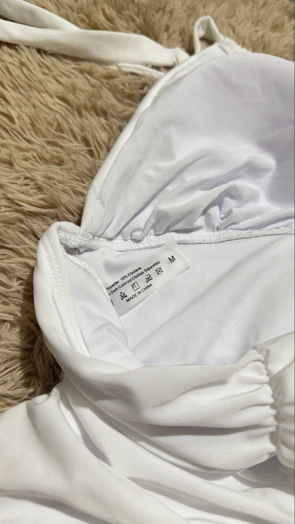 White Halterneck Ruched Swimsuit (Category: Bikinis & Swimsuits) located in Quezon City. Submitted by dearpretty.ph (Listing ID 1461047000, Image 2). Description: Small-Medium size M on tag Camera used: iPhone 15 Pro Max Colors may slightly vary due to lighting.