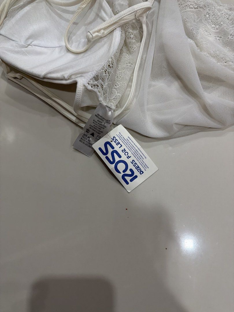 White Lace Bodysuit with Strappy Back (Category: Others Tops) located in Rizal. Submitted by macristina33105 (Listing ID 1461025262, Image 2). Description: - White lace bodysuit - Strappy detail on the back - Padded cups for support - Snap closure at the bottom - Estimated size: Medium - Versatile: great for layering or wearing on its own.