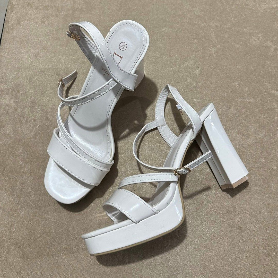 White Platform Block Heels with Ankle Strap (Category: Heels) located in Caba. Submitted by mademoiselle_jan (Listing ID 1460991932, Image 2). Description: - White platform heels - Chunky block heel - Strappy design across the front - Adjustable ankle strap - Size 40 - 4.5 inches - Adds height and stability - Ideal for dressing up outfits - no box -Once used, for graduation only..