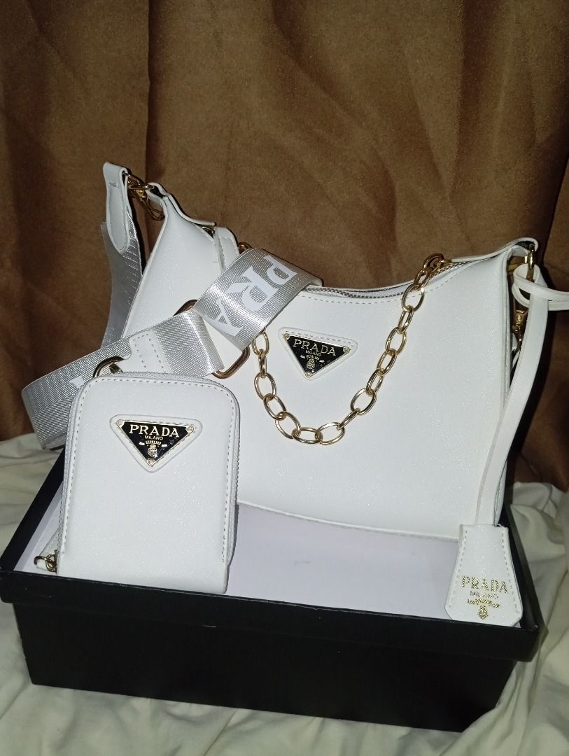White Prada Handbag Set with Pouch and Card Holder (Category: Luxury Bags & Wallets) located in Caloocan City. Submitted by kimmyuy (Listing ID 1461063134, Image 1). Description: •Condition: Clean and well-maintained •Inclusions: dust bag, no box. .