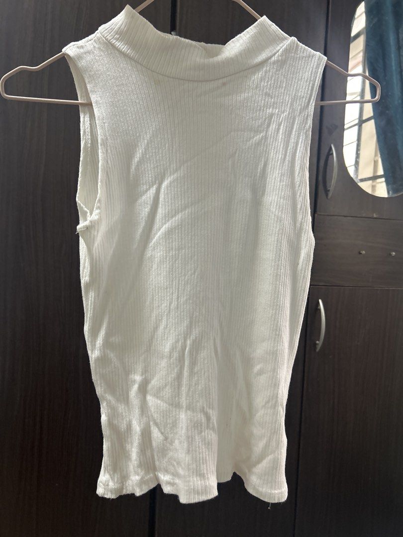 White Ribbed Mock Neck Sleeveless Top (Category: Sleeveless) located in Manila. Submitted by silverhawk.069da5 (Listing ID 1460950451, Image 1). Description: - White ribbed sleeveless top - Mock neck design - Stretchy material for a comfortable fit - Perfect basic for layering or wearing alone - Effortlessly matches with jeans, skirts, and more.