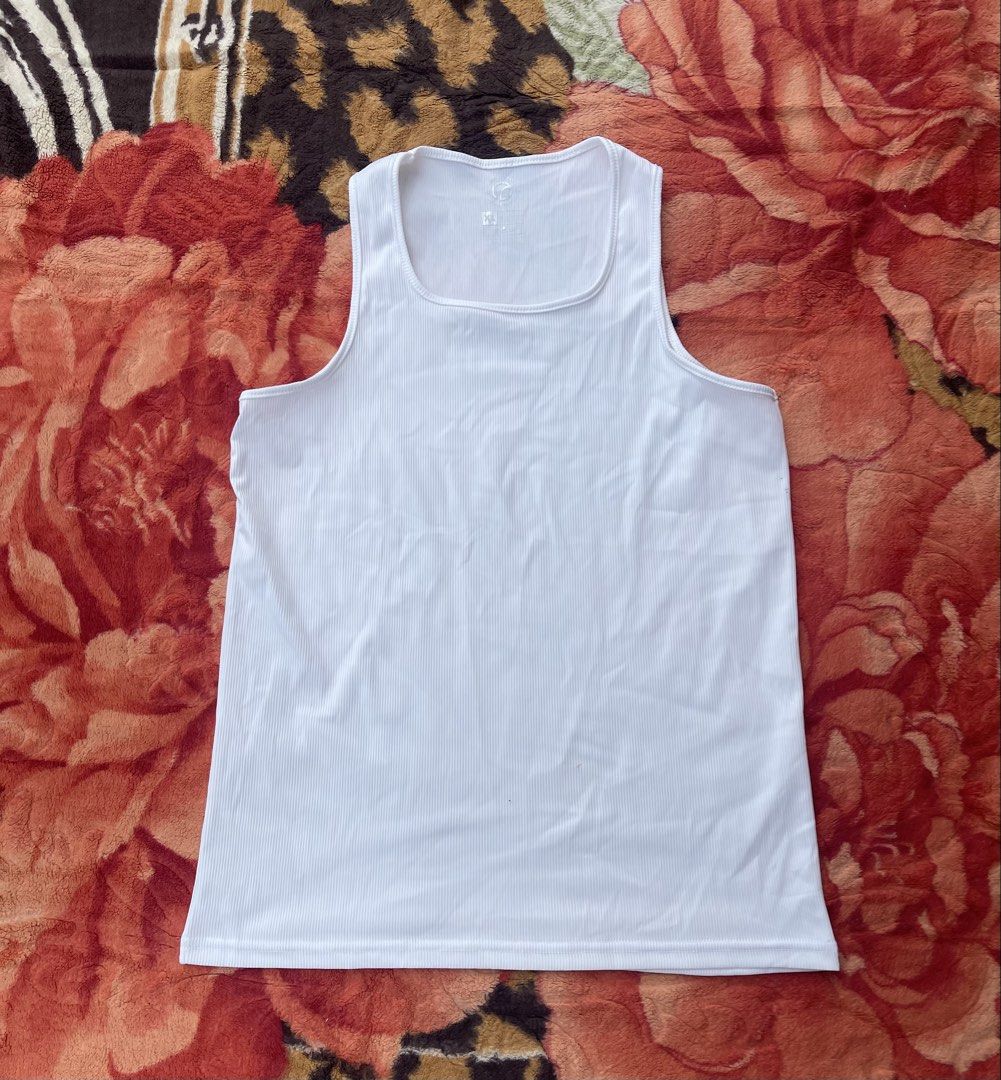 White ribbed tank top (Category: Sleeveless) located in Manila. Submitted by aikyy_ (Listing ID 1460922993, Image 1). Description: - Basic white ribbed tank top - Features a stylish square neckline - Comfortable and versatile for any outfit - Ideal for layering or wearing solo - Effortlessly matches with your existing wardrobe - Perfect for casual everyday wear - Bestfit - Large.