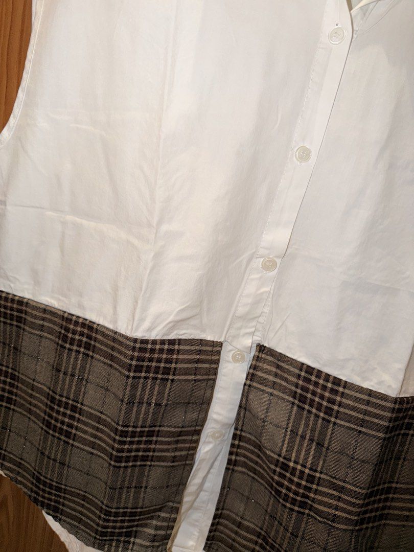 White Sleeveless Shirt with Plaid Bottom (Category: Shirts) located in Caloocan City. Submitted by jonaliemae09842 (Listing ID 1461095812, Image 2). Description: - White sleeveless shirt - Plaid panel detail at the bottom - Button-up front - Perfect for layering or wearing alone - Easy to style for various looks Up to XL.