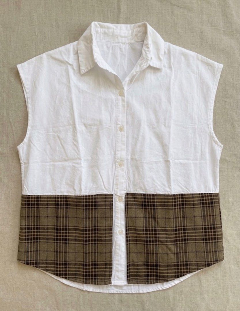 White Sleeveless Shirt with Plaid Bottom (Category: Shirts) located in Caloocan City. Submitted by jonaliemae09842 (Listing ID 1461095812, Image 1). Description: - White sleeveless shirt - Plaid panel detail at the bottom - Button-up front - Perfect for layering or wearing alone - Easy to style for various looks Up to XL.