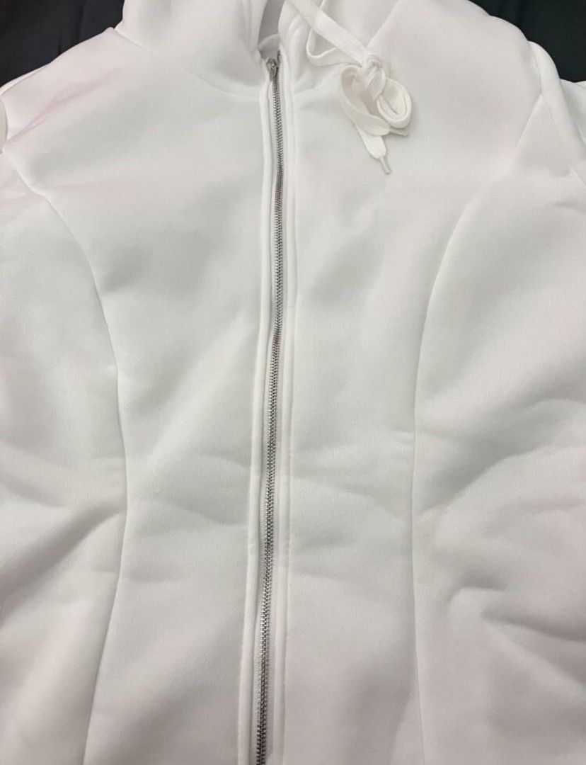 White Zip-Up Hoodie (Category: Coats, Jackets and Outerwear) located in Manila. Submitted by renznrs (Listing ID 1461078811, Image 2). Description: - White zip-up hoodie - Size Large - Worn only once - No issues, looks brand new - Ideal for casual wear.