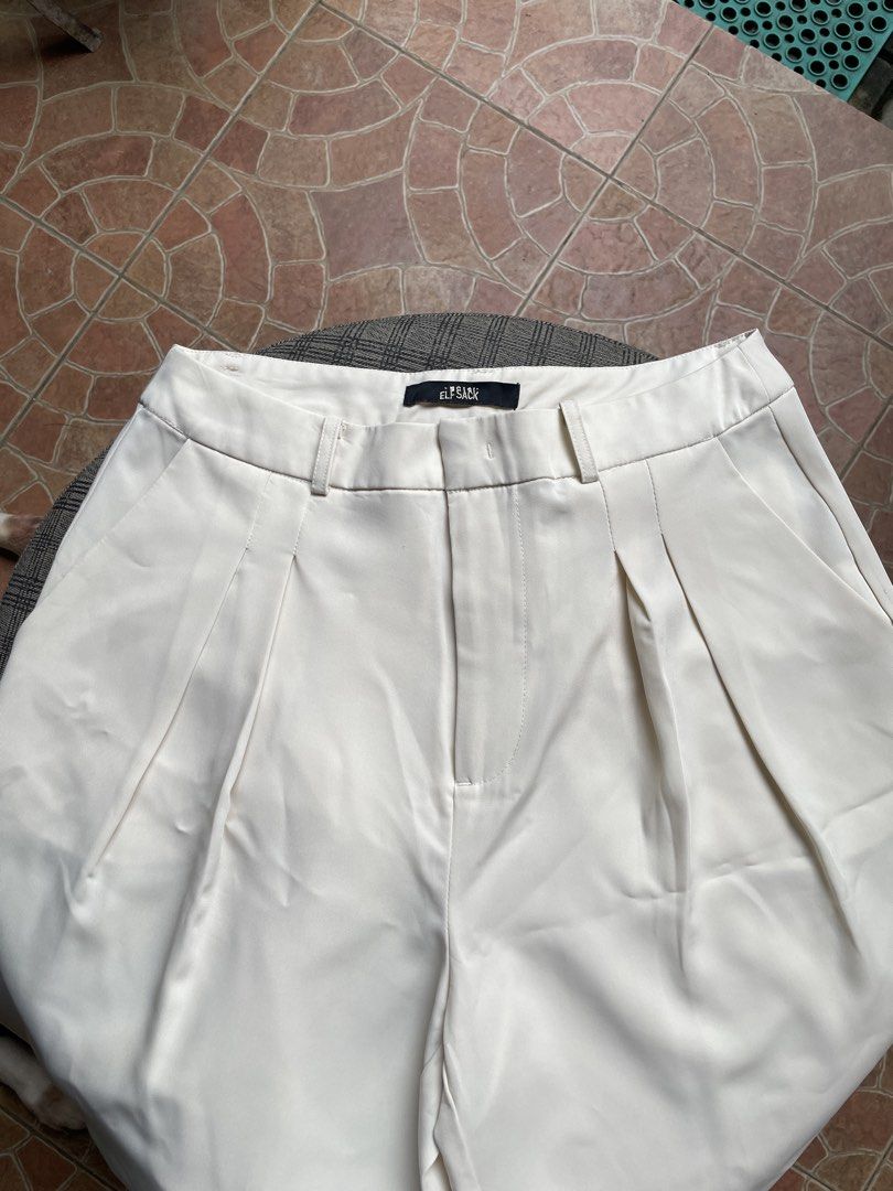 wide leg trousers (Category: Other Bottoms) located in Antipolo. Submitted by eferdzx (Listing ID 1453041475, Image 2). Description: 1 issue: hook needs stitching - waistline: 25 inches - length: 99 cm - Beige wide leg trousers - Brand: Elf Sack - High-waisted design.