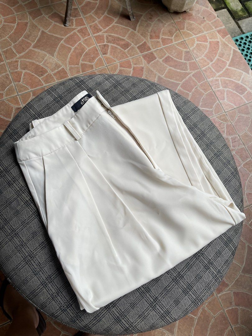 wide leg trousers (Category: Other Bottoms) located in Antipolo. Submitted by eferdzx (Listing ID 1453041475, Image 1). Description: 1 issue: hook needs stitching - waistline: 25 inches - length: 99 cm - Beige wide leg trousers - Brand: Elf Sack - High-waisted design.