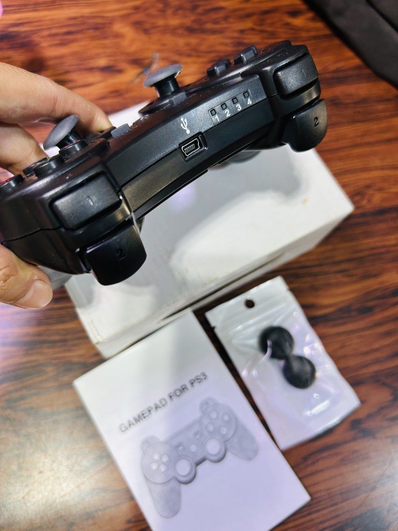 Wireless Gamepad Controller for PS3 (Category: Controllers) located in Manila. Submitted by starbalesukandjapansurplus (Listing ID 1460949624, Image 2). Description: - Black Wireless Controller for PS3 - Tested and confirmed working - Includes original manual - Comes with extra thumb grips - Connects via USB cable - Ideal for extended gaming sessions.