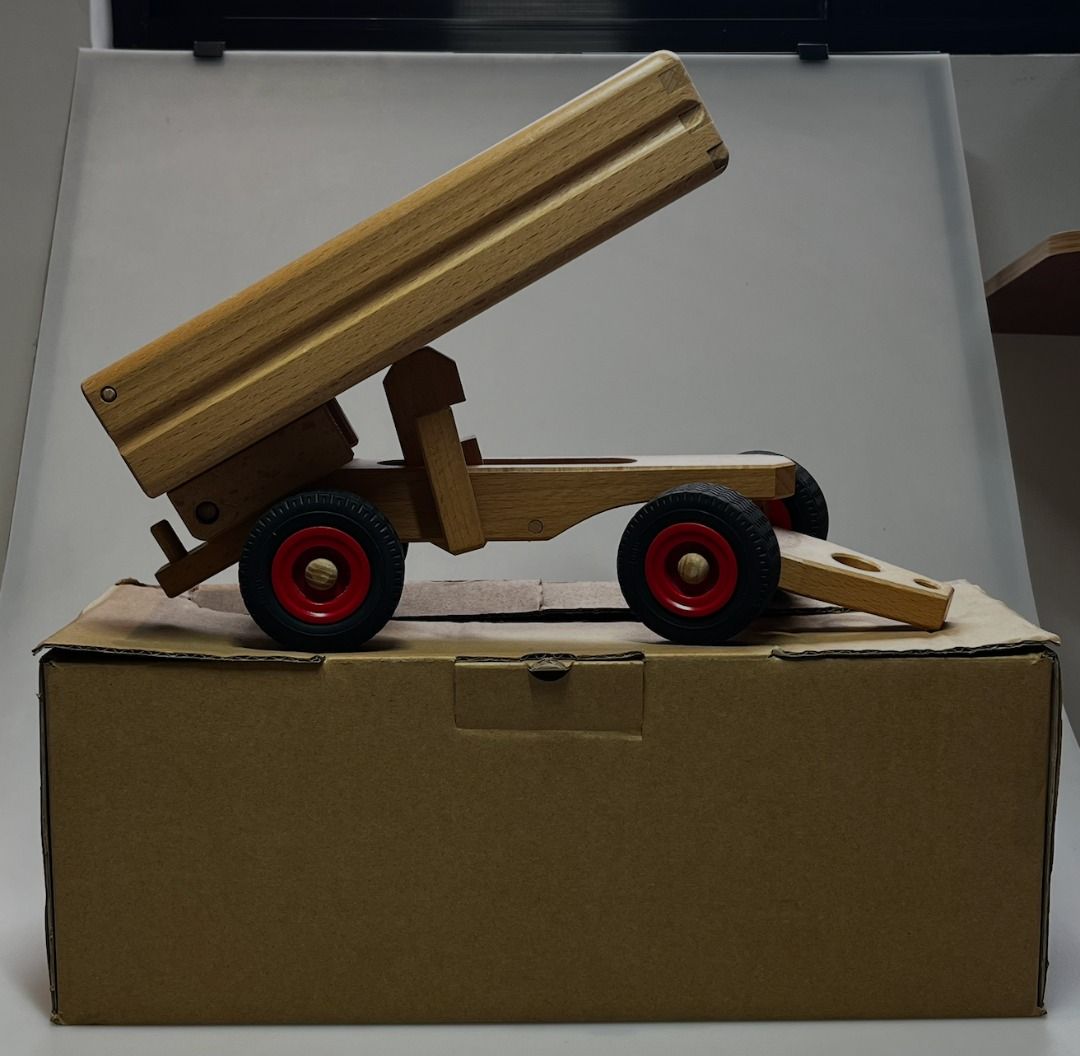 Wooden Dump Truck Toy (Category: Kids Toys) located in San Juan City. Submitted by protoolsmnl (Listing ID 1461048793, Image 3). Description: Classic wooden dump truck. The bed lifts up and down. Made from solid wood with red wheels. Great for imaginative play. Perfect for little hands. Durable and timeless toy..