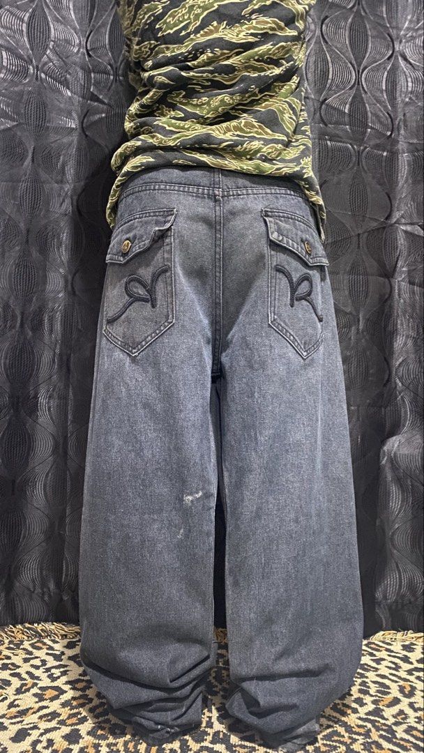 Y2K ROCAWEAR (Category: Jeans) located in Cabuyao City. Submitted by badthrift_pat (Listing ID 1460931680, Image 1). Description: Y2K ROCAWEAR 👖WAIST:38 👖WIDTH:44.5 👖THIGH:14.5 👖LEG OPEN:9.2 FLAWS:SCRATCH/DISTRESS 🏷️:1.299.