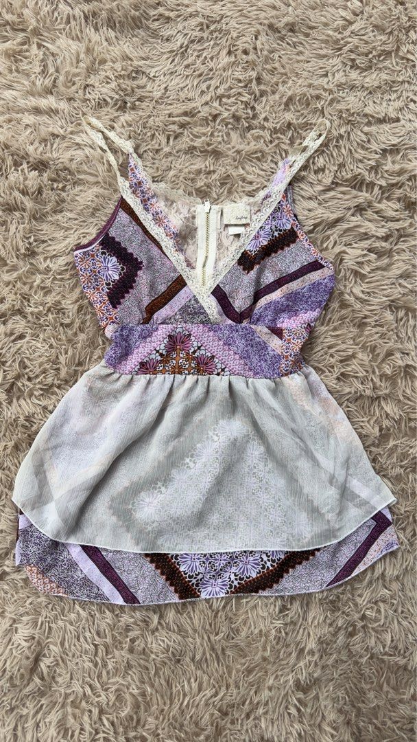 Y2K TOP (Category: Sleeveless) located in La Trinidad. Submitted by ariane_lyka12 (Listing ID 1460924156, Image 1). Description: purple and white patchwork cami top with lace trim and a semi-sheer layered peplum hem..