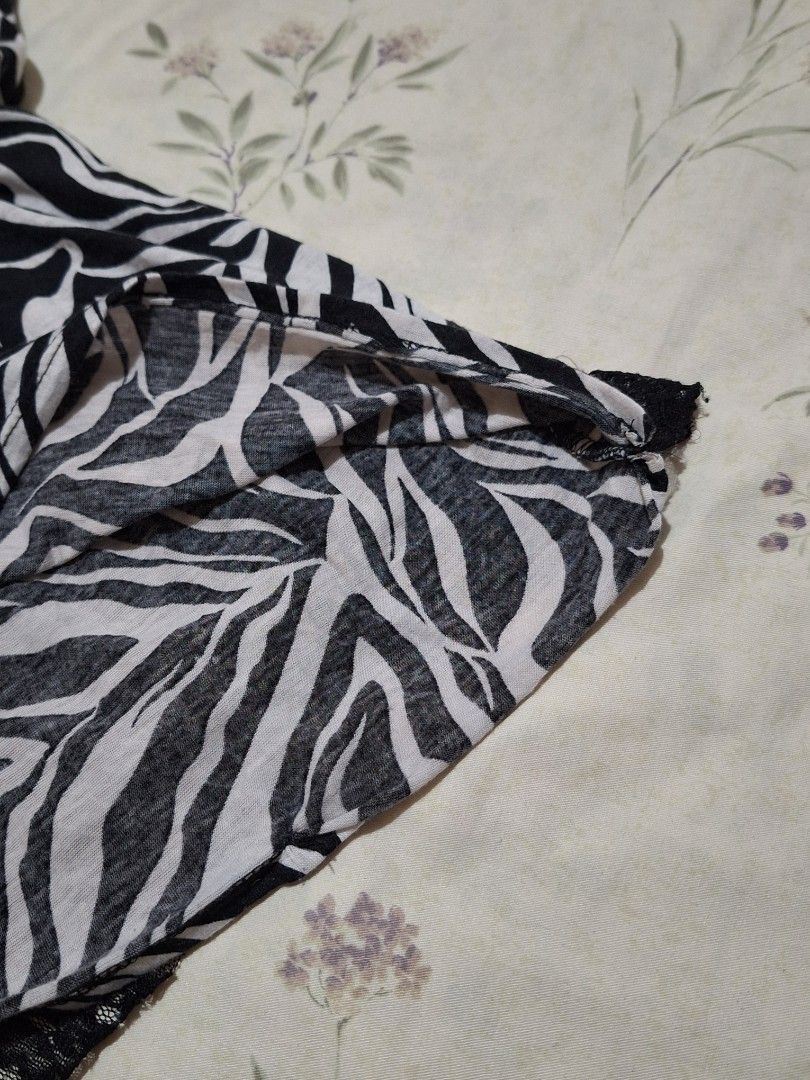 Y2k Zebra Print Layered Mesh Top (Category: Blouses) located in Taguig. Submitted by butterflypea.thrift (Listing ID 1460967292, Image 2). Description: - Eye-catching black and white zebra print - Unique layered mesh and lace design - Sleeveless with a flattering scoop neckline - Estimated size: Small to Medium - size: bust - 30 , length - 36 - Ideal for a stylish night out or as a statement piece.