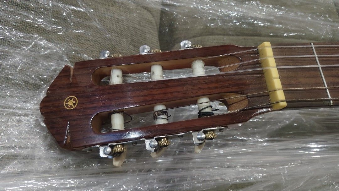Yamaha Classical Guitar CG-85D (Category: Musical Instruments) located in Manila. Submitted by joshespino71762 (Listing ID 1460928018, Image 2). Description: - Yamaha CG-85D Classical Guitar - Nylon Strings - Natural Wood Finish - Ideal for Beginners or Intermediate Players - Tuners in Good Working Order - Minor Scuffs on Back (Normal Wear) - Selling As Is.