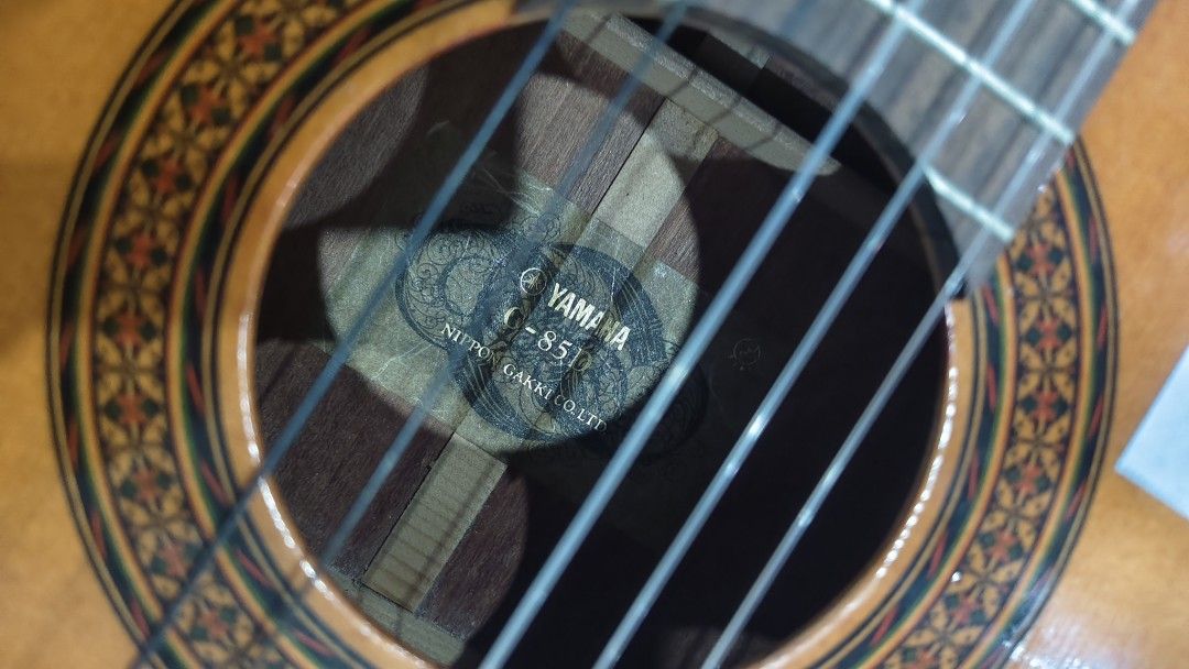 Yamaha Classical Guitar CG-85D (Category: Musical Instruments) located in Manila. Submitted by joshespino71762 (Listing ID 1460928018, Image 3). Description: - Yamaha CG-85D Classical Guitar - Nylon Strings - Natural Wood Finish - Ideal for Beginners or Intermediate Players - Tuners in Good Working Order - Minor Scuffs on Back (Normal Wear) - Selling As Is.