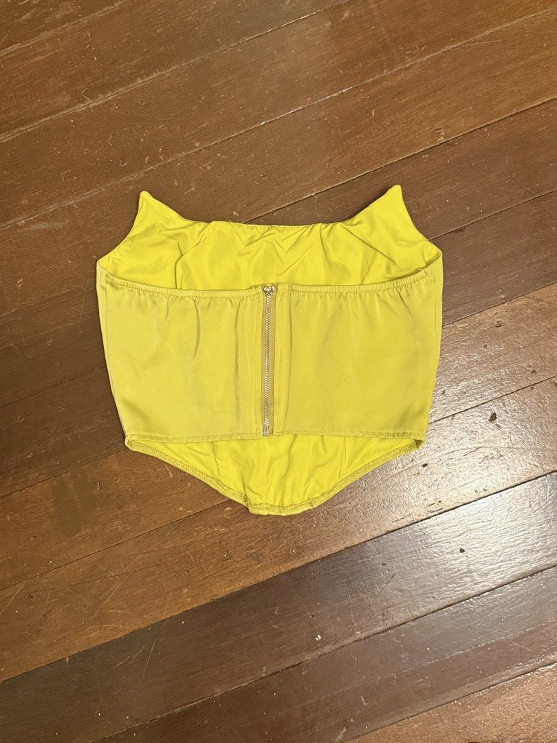 Yellow Corset Top with Zipper Back (Category: Others Tops) located in Angeles City. Submitted by lesmiz24601 (Listing ID 1460976502, Image 2). Description: - Trendy yellow corset top - Features a convenient back zipper closure - Fabric has a beautiful slight sheen - Best fits size Small to Medium - Versatile piece for dressing up or down.
