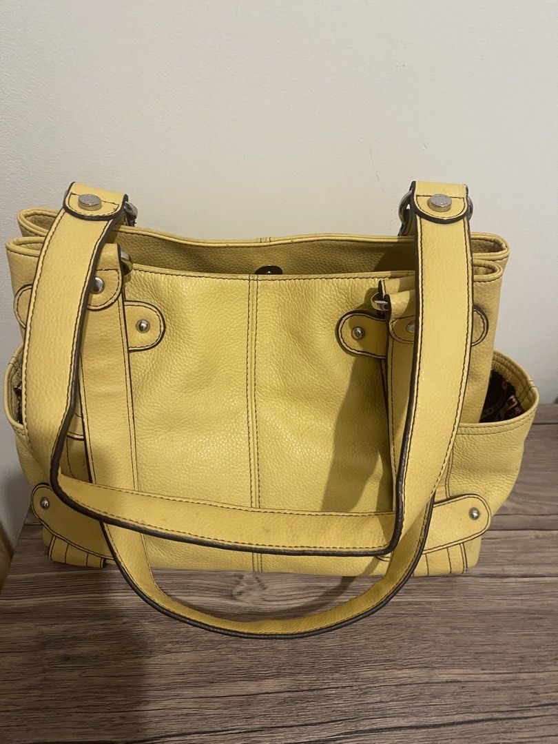 Yellow Leather Tote Bag (Category: Tote Bags) located in Taguig. Submitted by sellall37207 (Listing ID 1461111873, Image 1). Description: - Cute yellow pebbled leather tote bag - Spacious interior - Two convenient side pockets - Comfortable straps - Perfect for everyday use.