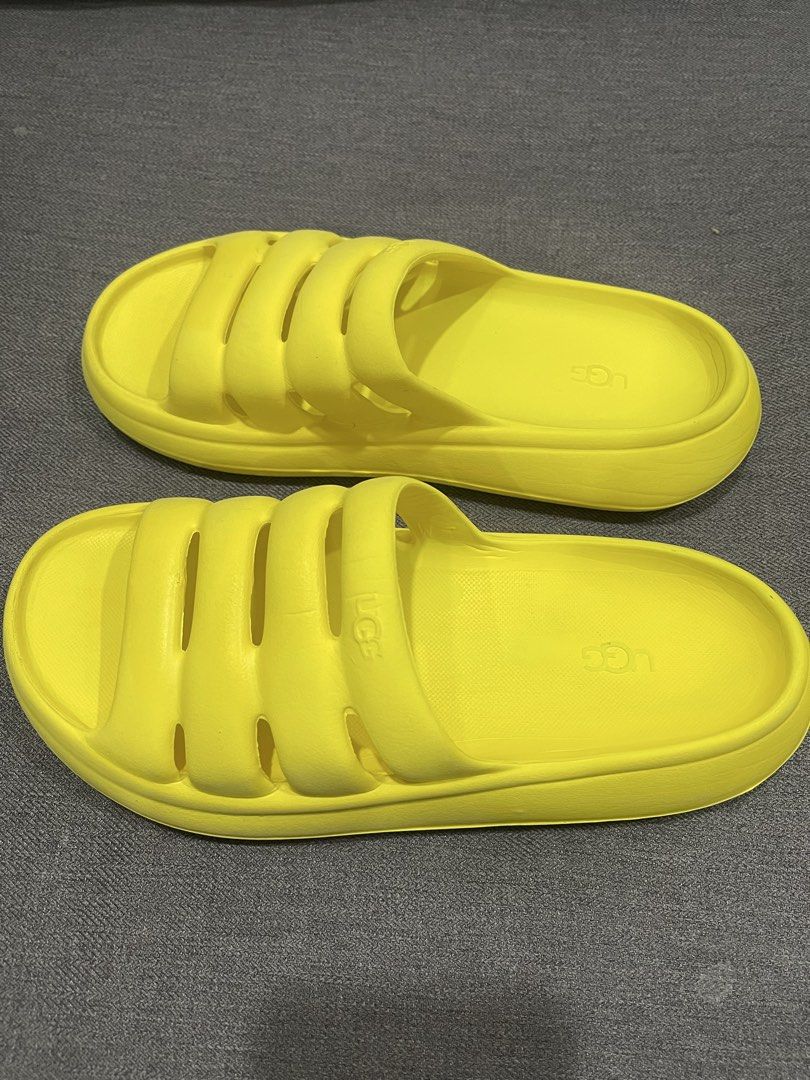 Yellow UGG Slides (Category: Slippers and slides) located in Minglanilla. Submitted by mi_jin (Listing ID 1460938255, Image 3). Description: -Us7 24cm -Missing strap - Bright yellow UGG slides - Easy slip-on style - Embossed UGG logo on footbed and strap - Textured grip sole - Ideal for casual wear or by the pool.