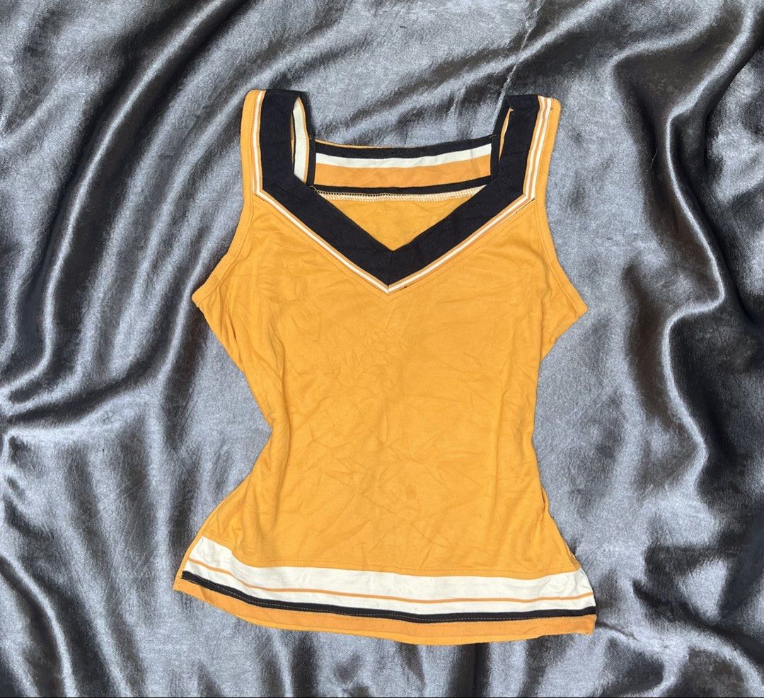 Yellow V-Neck Tank Top with Striped Trim (Category: Sleeveless) located in Cavite. Submitted by bellewii (Listing ID 1461069891, Image 1). Description: - Adorable yellow tank top - Flattering V-neck design - Chic black and white striped trim on neckline and hem - Sleeveless for comfort - Versatile for casual outfits or layering.