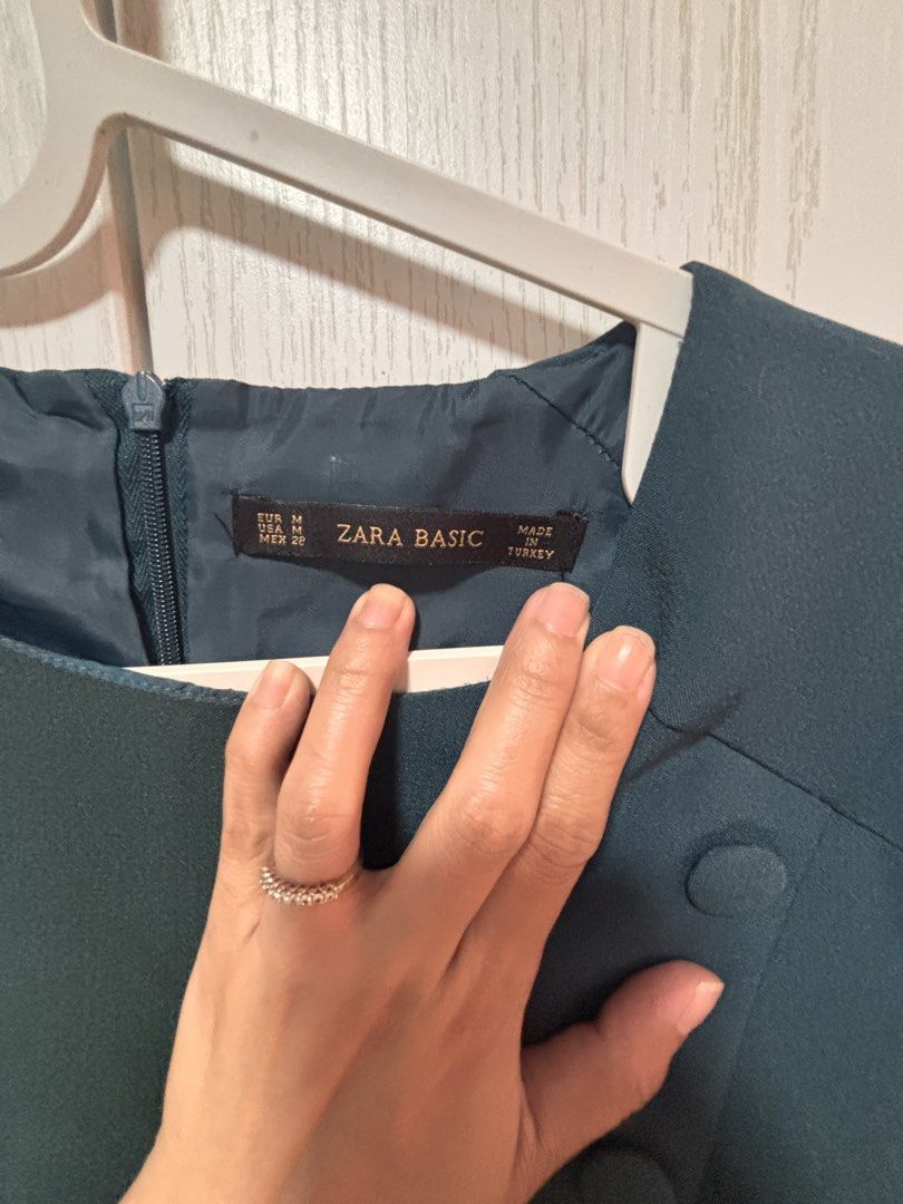 Zara Basic Dark Teal Button Detail Short Sleeve Dress Size M (Category: Dresses) located in Manila. Submitted by sophiadaphne (Listing ID 1460927503, Image 3). Description: - Zara Basic dark teal dress - Short sleeves with unique front button detail - Zipper closure at the back - Made in Turkey - Versatile for work or casual outings Shoulder to Hem: 34in Bust: up to 37in Waist: up to 31in.