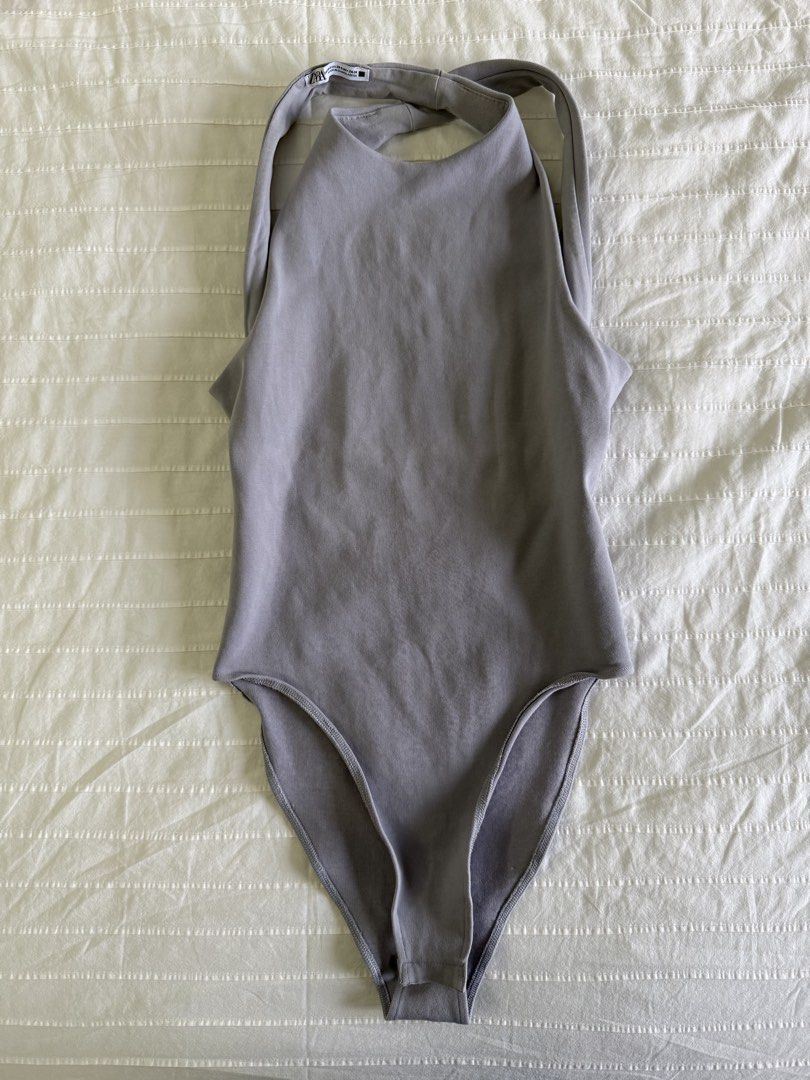 Zara Blue Gray Halterneck Low-Back Bodysuit (Category: Sleeveless) located in Tarlac. Submitted by samdeclutters_ (Listing ID 1461007059, Image 1). Description: - Size: XS-S - Color: Muted Blue Gray - Features: Low-cut back with cross straps; standard bottom snap-button closure - Used twice.