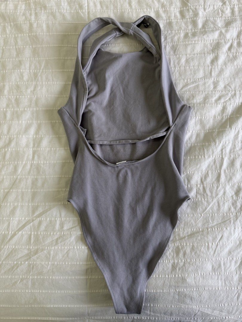 Zara Blue Gray Halterneck Low-Back Bodysuit (Category: Sleeveless) located in Tarlac. Submitted by samdeclutters_ (Listing ID 1461007059, Image 2). Description: - Size: XS-S - Color: Muted Blue Gray - Features: Low-cut back with cross straps; standard bottom snap-button closure - Used twice.