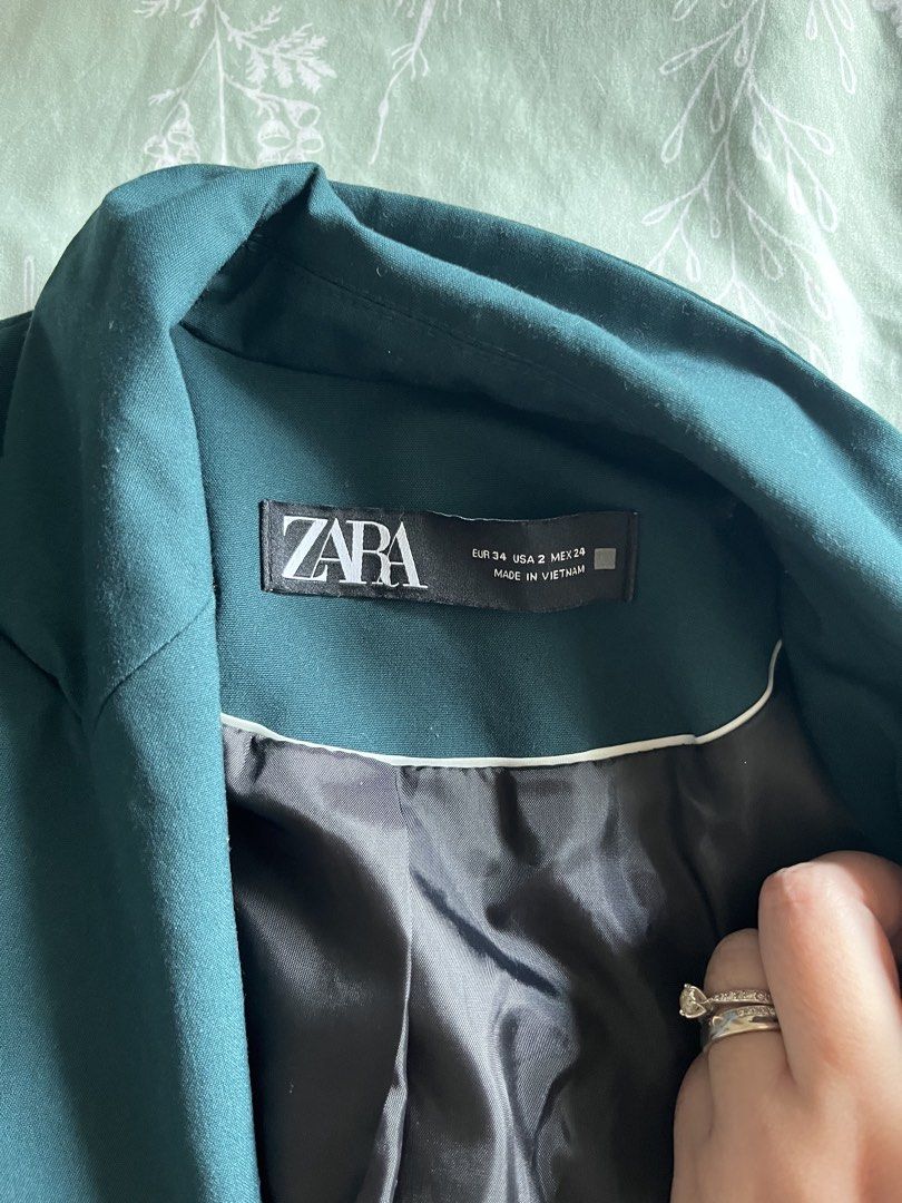 Zara Dark Green Blazer (Category: Coats, Jackets and Outerwear) located in Quezon City. Submitted by byebooks (Listing ID 1460965829, Image 2). Description: - Zara dark green blazer - Button front closure - Two buttons on each cuff - Fully lined interior - Versatile: perfect for dressing up or down Bought from Zara Canada It has brought my life a bit of luck as I passed most job interviews wearing this blazer RFS: my arms are too big for it na :(