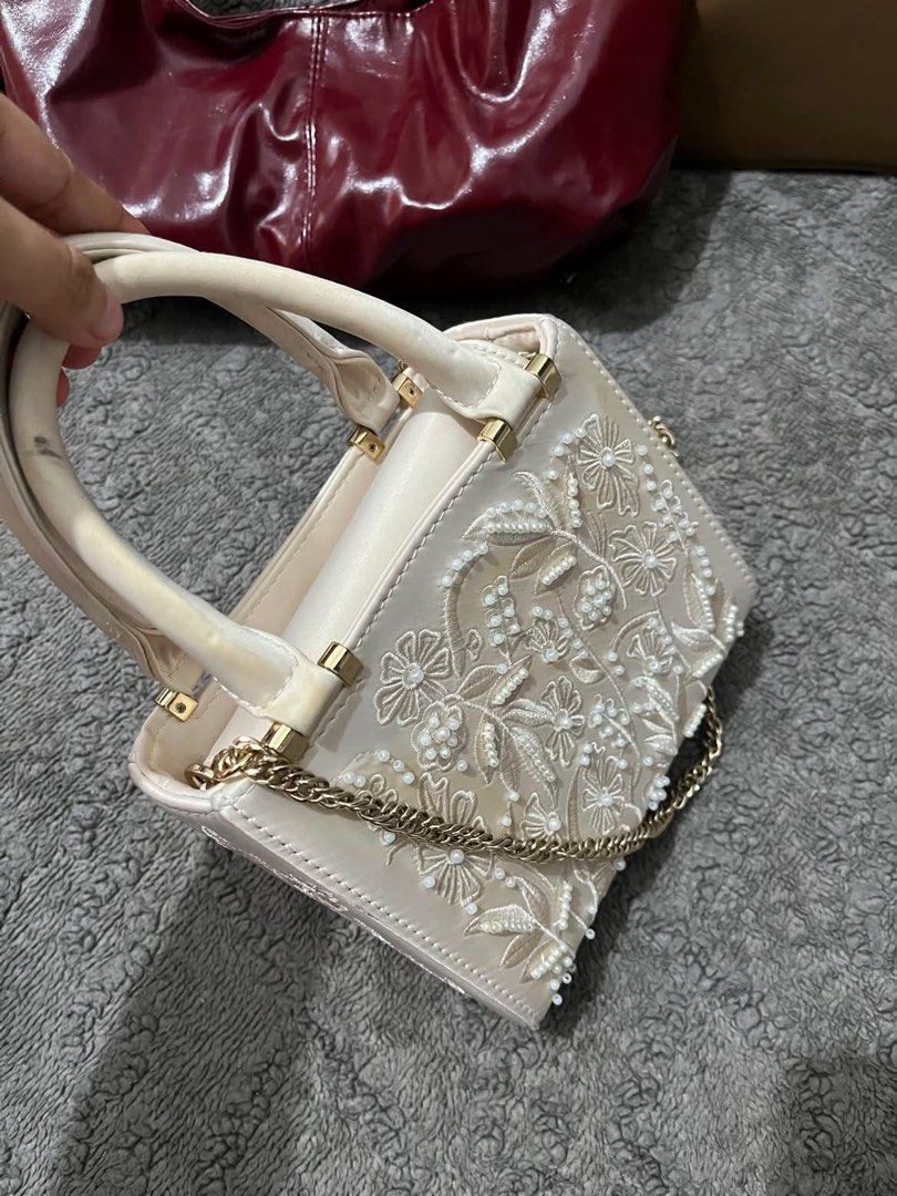Zara Embroidered Top Handle Bag (Category: Shoulder Bags) located in Manila. Submitted by luckyeagle-6f71 (Listing ID 1461009805, Image 3). Description: - Cute Zara bag with beautiful floral embroidery - Features top handles for easy carrying - Includes a detachable chain strap for versatile styling - Embroidery is detailed with beads and threadwork - Ideal for evening events or special occasions - Original tag price: 35.95 PHP.