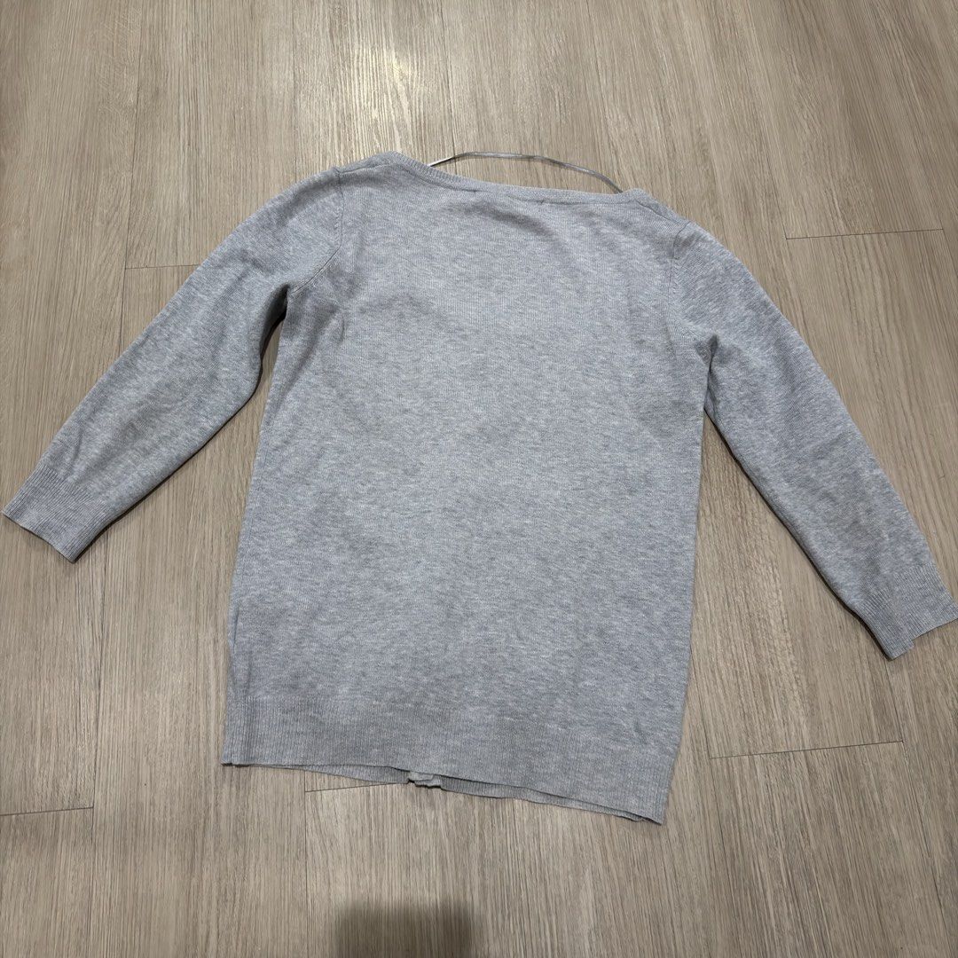 ZARA Grey Button-Up Cardigan (Category: Coats, Jackets and Outerwear) located in Manila. Submitted by sg.21 (Listing ID 1461059247, Image 2). Description: - Grey long-sleeved cardigan from ZARA - Button-up front - Scoop neckline - Classic and versatile for layering Armpit 16” Length 22”.
