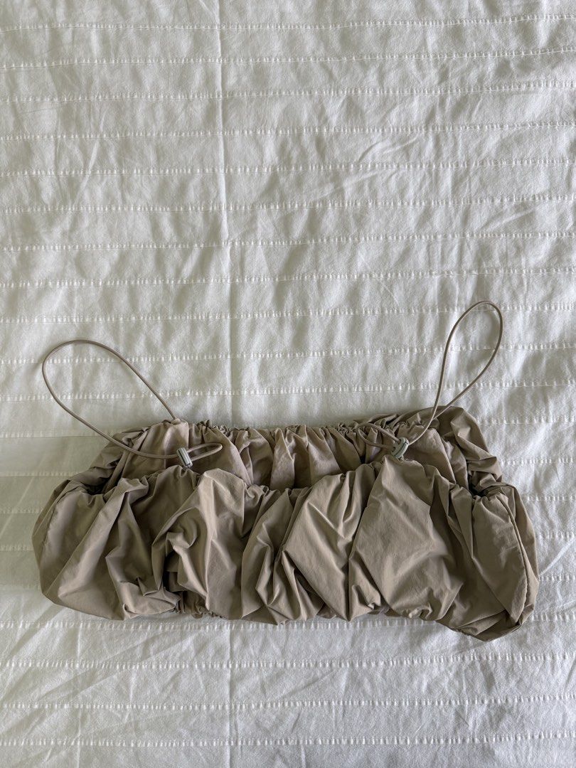 Zara Taupe Voluminous Crop Top (Category: Sleeveless) located in Tarlac. Submitted by samdeclutters_ (Listing ID 1461008680, Image 3). Description: - Size: S - Color: Taupe - Material: Nylon / Cotton - Features: Heavily crunched, bubble-hem silhouette with ultra-thin spaghetti straps - Used 2x.