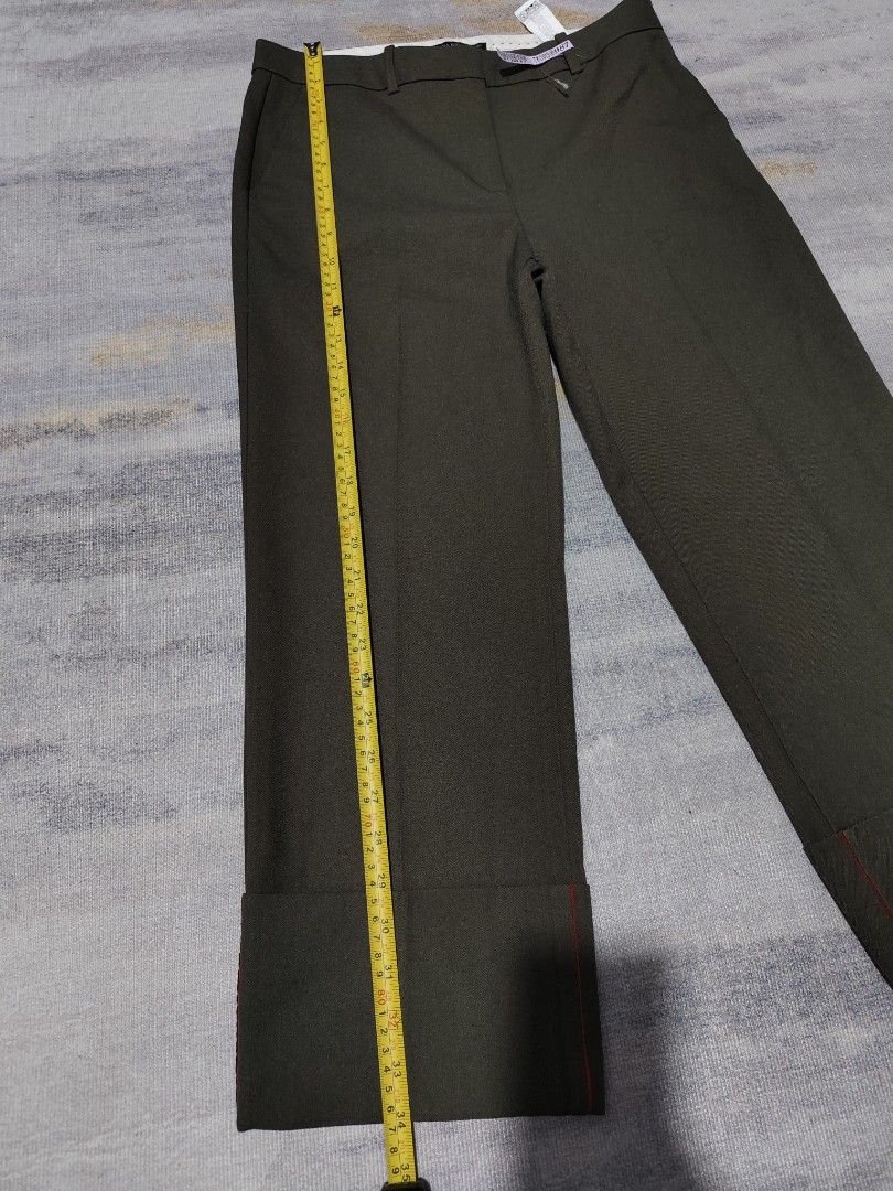 ZARA TROUSERS (Category: Other Bottoms) located in Dagupan City. Submitted by gandita.28 (Listing ID 1461050890, Image 2). Description: olive green cropped trousers with wide cuffed hems and a subtle red accent line. Brandnew ( tag removed ) color may vary due to lighting small on tag but fits until size 28 only.