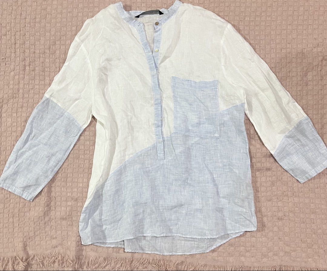 Zara White & Blue Linen Blend Shirt (Category: Shirts) located in Mandaluyong City. Submitted by hopeworldplane (Listing ID 1461076168, Image 1). Description: - Lightweight linen blend fabric - Unique white and light blue color block design - Band collar with buttoned placket - One chest pocket - Long sleeves - Ideal for a casual, breezy look.