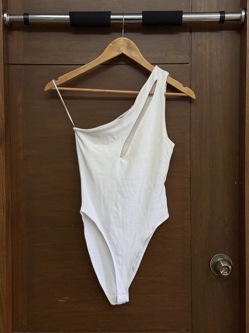 Zara White Cut-out One-Shoulder Bodysuit (Category: Sleeveless) located in Tarlac. Submitted by samdeclutters_ (Listing ID 1461006778, Image 1). Description: - Size: S - Features: Cut-out detail across the front chest area; standard snap-button closure - Never used, only washed once.