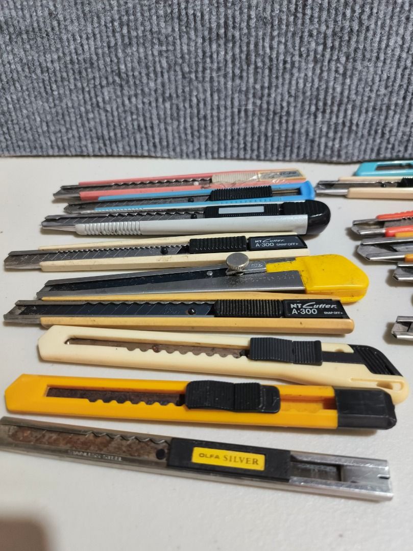 17 pcs Assorted Utility Knives - Olfa, NT Cutter, and more (Category: Knives & Chopping Boards) located in San Leonardo. Submitted by burgossanleonardo.12345 (Listing ID 1461176592, Image 3). Description: - Bundle of utility knives featuring Olfa and NT Cutter brands. - Includes various models and colors. - Condition ranges from signs of use to barely touched. - Blades are sharp and ready for immediate use. - Ideal for crafting, cutting, and DIY 