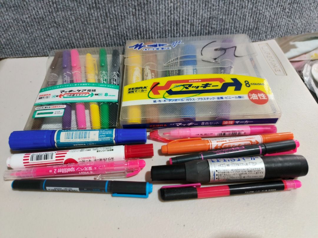 19pcs Oil-Based Markers Set (Category: Stationery & School Supplies) located in San Leonardo. Submitted by burgossanleonardo.12345 (Listing ID 1461184343, Image 1). Description: - Set includes 8 Zebra Macky oil-based markers. - Also includes assorted other markers and highlighters. - Some items are in original packaging, others are individual. - All pens are visible in the provided photos. - Ideal for various art and craft projects..