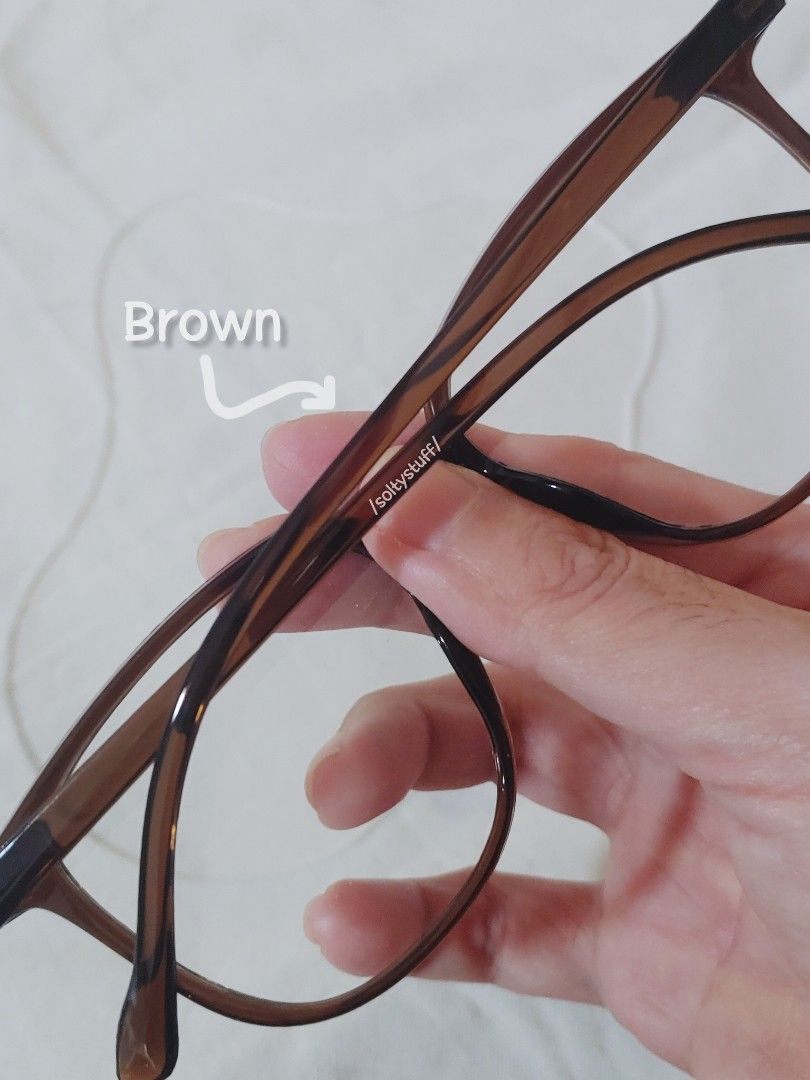 2 pcs. Glasses from Tiktok shop (Category: Sunglasses & Eyewear) located in Malolos. Submitted by soltyx (Listing ID 1461142961, Image 2). Description: price is for both used for affiliate video only unisex Color: Brown and Olive Green.