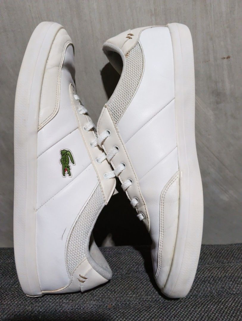 8 MEN Lacoste (Category: Sneakers) located in Cavite. Submitted by ronessabrandedshoes2ndaccount (Listing ID 1461228427, Image 1). Description: - White Lacoste sneakers - Iconic crocodile logo on the side - Secure lace-up closure - Perfect for everyday casual wear.
