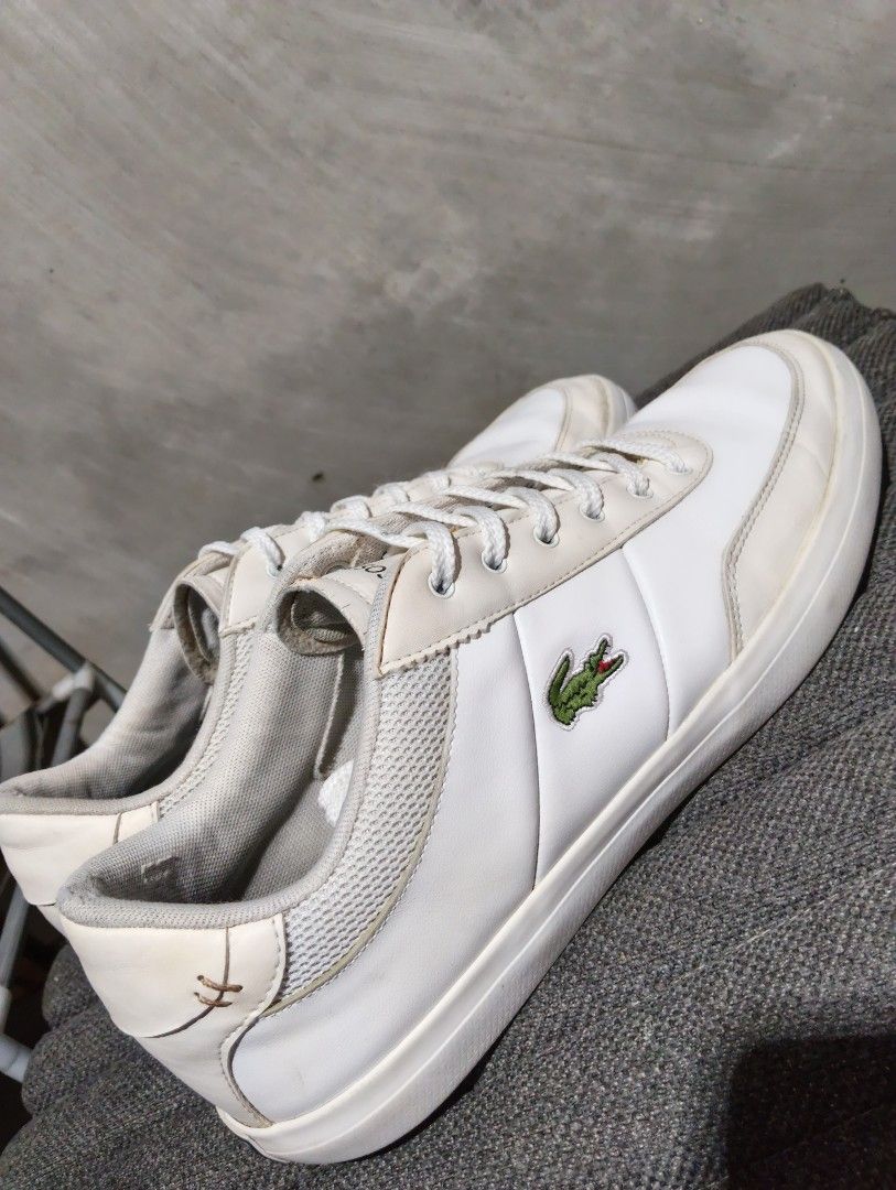 8 MEN Lacoste (Category: Sneakers) located in Cavite. Submitted by ronessabrandedshoes2ndaccount (Listing ID 1461228427, Image 2). Description: - White Lacoste sneakers - Iconic crocodile logo on the side - Secure lace-up closure - Perfect for everyday casual wear.