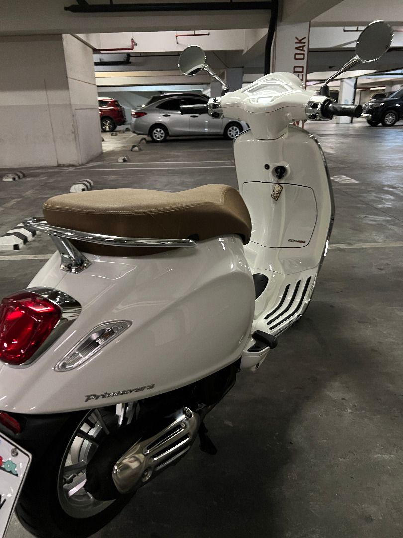 🛵 2023 Vespa Primavera 150 (Category: Other Motorcycles Parts and Accessories) located in Taguig. Submitted by leemenghsien (Listing ID 1461189532, Image 2). Description: 🛵 2023 Vespa Primavera 150 | White Plate: 520*** (520 = "I Love You" in Chinese numerology — a lucky, memorable plate!) Location: Two Serendra, BGC Personal use only, purchased August 2023. Always parked indoor, rarely used, well maintained, and no scratches. Details: 1. Milea