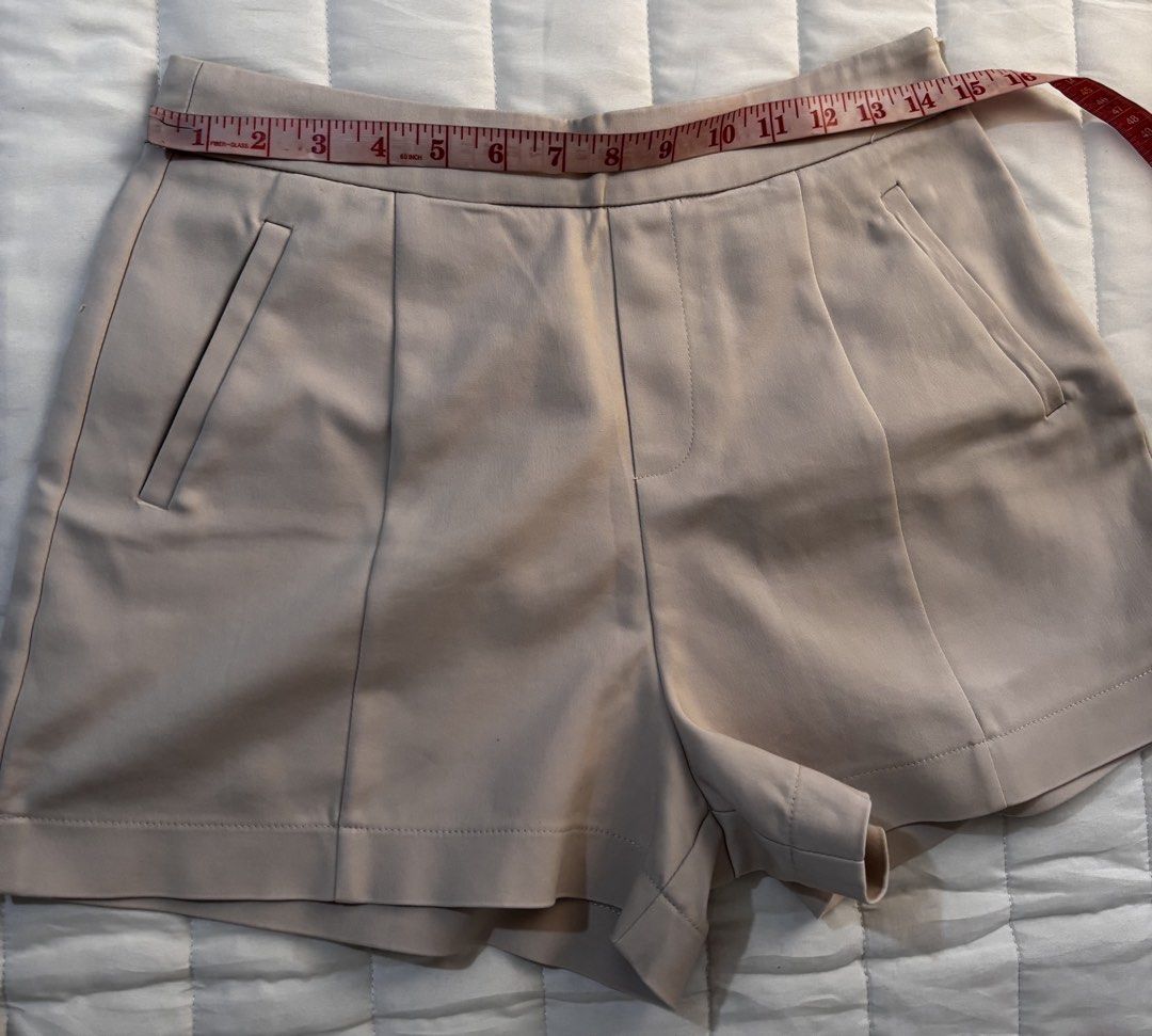 ✨ IORA Tailored Beige High-Waisted Shorts (Category: Shorts) located in Manila. Submitted by hellothere2012 (Listing ID 1461323065, Image 2). Description: Minimalist and classy beige shorts from IORA, featuring a structured tailored cut, front pleats, slanted side pockets, and a neat waistband. Perfect for office outfits, smart casual looks, or elevated everyday styling. 📌 Details: * Brand: IORA * Size: M (EUR 38 / UK 10) * Color: Beige / Nude *