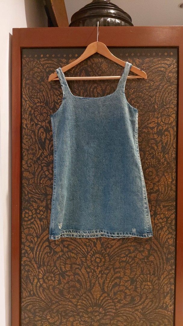 💯 PRADA DENIM DRESS (Category: Dresses) located in Mandaluyong City. Submitted by arlene2560 (Listing ID 1461248247, Image 2). Description: 💯 Authentic blue denim mini dress by PRADA featuring the brand's signature triangular logo plaque on the chest. Small on tag, armpit 17", length 32". Decluttering P2500. Mandaluyong.