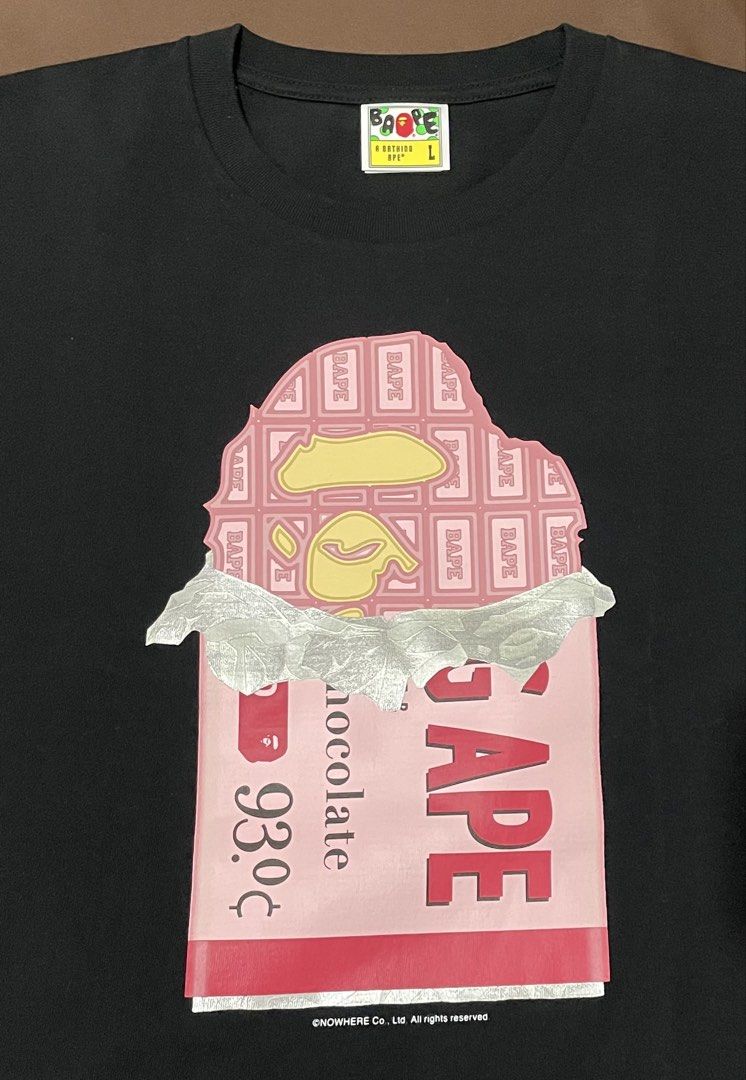 A Bathing Ape BAPE Strawberry Chocolate Tee (Category: Tshirts & Polo Shirts ) located in Manila. Submitted by jkm_g (Listing ID 1461271502, Image 2). Description: - Authentic A Bathing Ape (BAPE) T-shirt - Features the signature strawberry chocolate bar graphic on the front - Back print includes text referencing 'A Bathing Ape's Chocolate' and 'Bape's Strawberry Chocolate' - Size: Large (L) - Ideal for collectors and fans of the BAPE brand.
