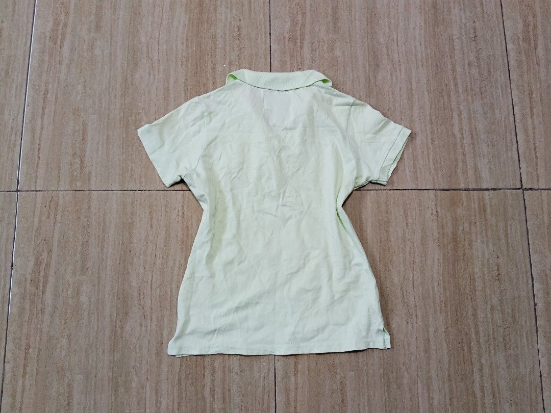 Abercrombie & Fitch womens top (Category: Activewear) located in Glan. Submitted by cpaharodde48008 (Listing ID 1461323624, Image 3). Description: - Cute light green Abercrombie & Fitch kids' polo shirt - Features a small embroidered bunny on the chest - Pink trim inside the collar for a pop of color - Short sleeves and button-up neckline - Ideal for everyday casual wear.