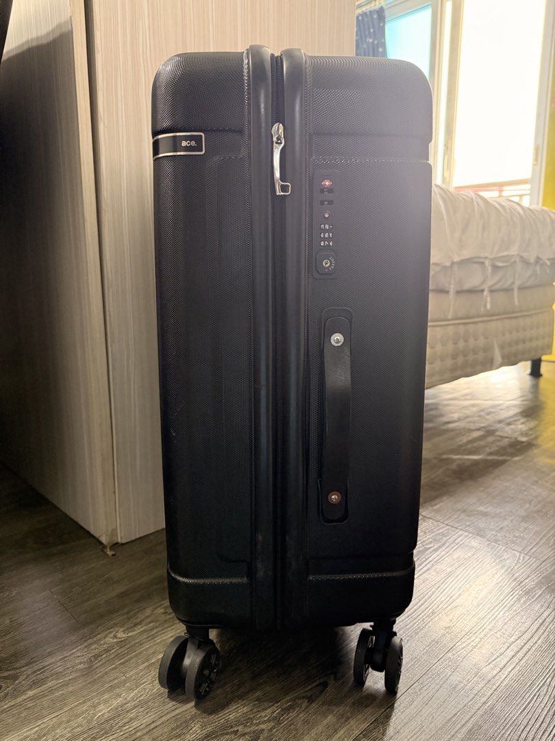 Ace Black Hardshell Spinner Luggage with TSA Lock (Category: Luggage) located in Taguig. Submitted by _annaq_ (Listing ID 1461139970, Image 3). Description: - ACE brand, made in Japan - black hardshell luggage - Features a TSA combination lock for security - Smooth rolling spinner wheels for easy maneuverability - Interior with mesh compartments for organization - Zippers are intact and functional - Handle extends and retracts properly - Great fo