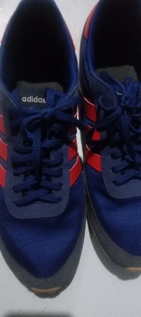 Adidas Blue and Red Sneakers (Category: Sneakers) located in Marikina City. Submitted by elenablinknini (Listing ID 1461320048, Image 2). Description: - Adidas sneakers in blue with red accents - Classic three stripes design - Lace-up closure for a secure fit - Durable rubber sole no flaws - Great for casual wear or light sports - Shows some signs of wear but still has plenty of life left.
