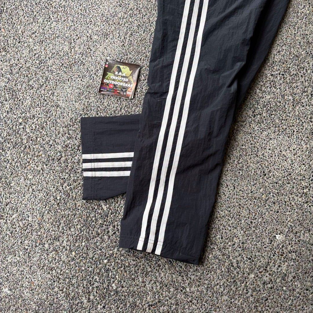 Adidas Human Race x Pharrell Williams (Category: Trousers) located in Caloocan City. Submitted by rjlthrifts (Listing ID 1461272186, Image 3). Description: Adidas Human Race x Pharrell Williams Excellent Condition Color Rate 10/10 24 - 26 Waist Line 40 Length No Issue. Price. 1,880 Loc. South Caloocan Courier. J&T And Flash Express.